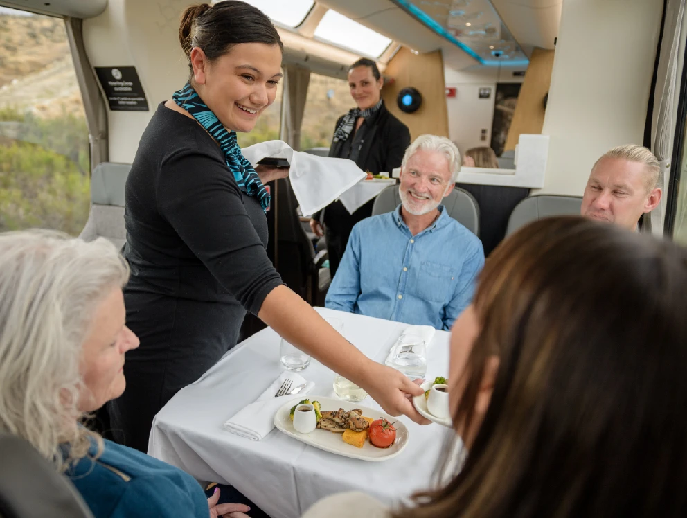 Scenic Plus hostess serving food