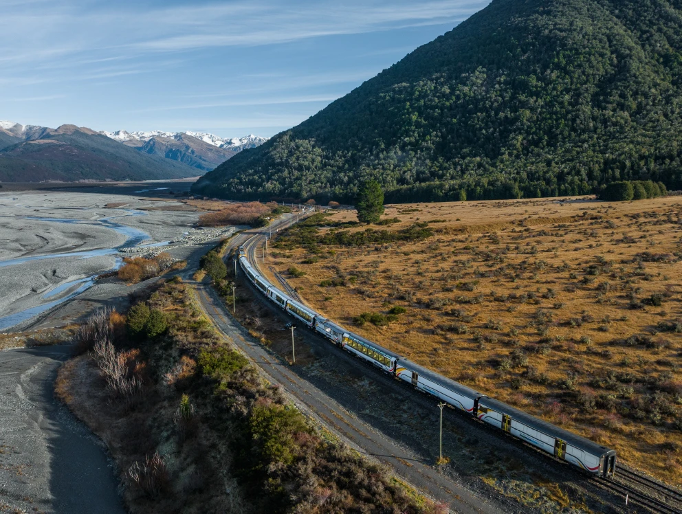TranzAlpine train travelling through rural area
