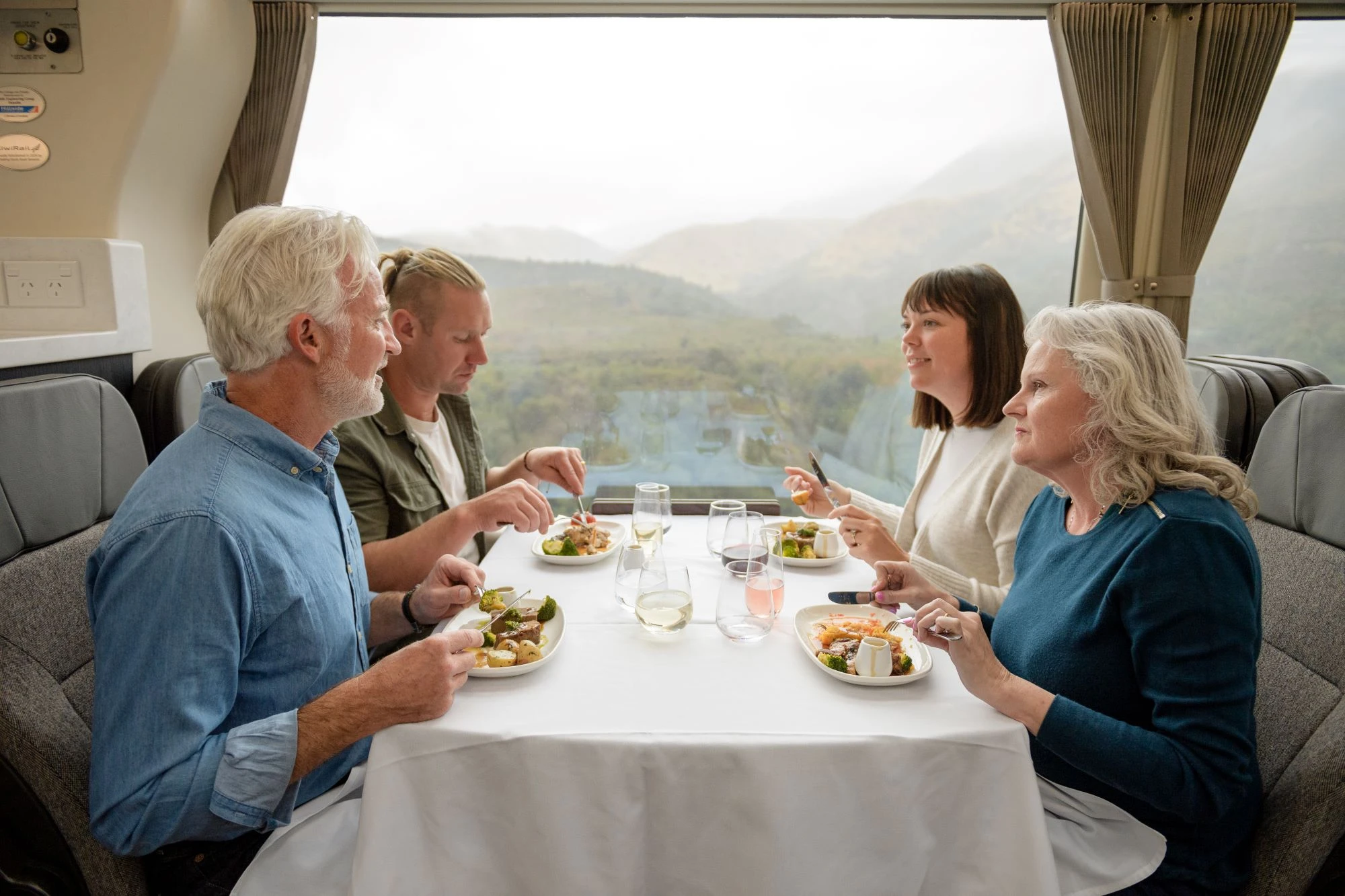 A group sharing a meal in Scenic Plus
