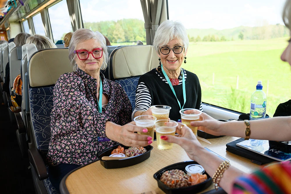WOW Train passengers with food and drink onboard the train