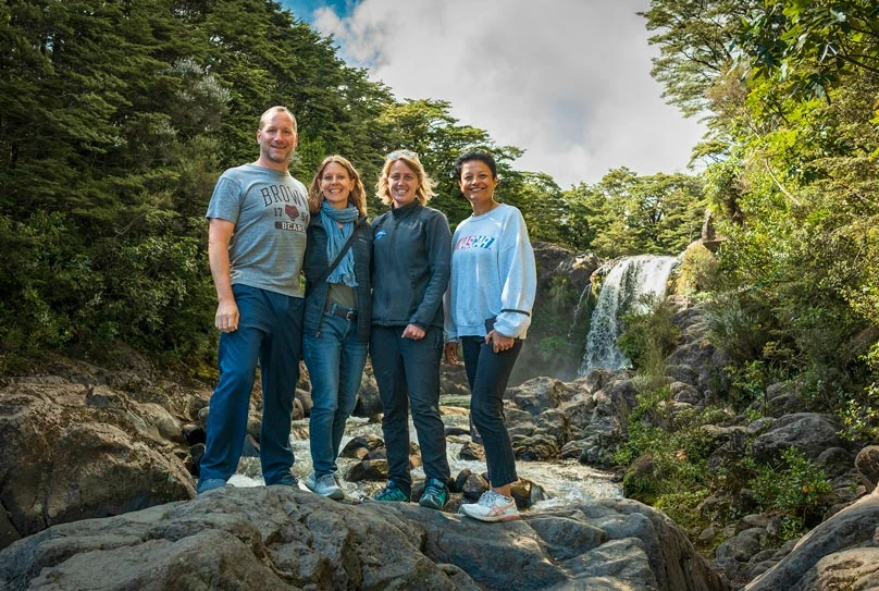 People standing in front of the magical Tawhai Falls