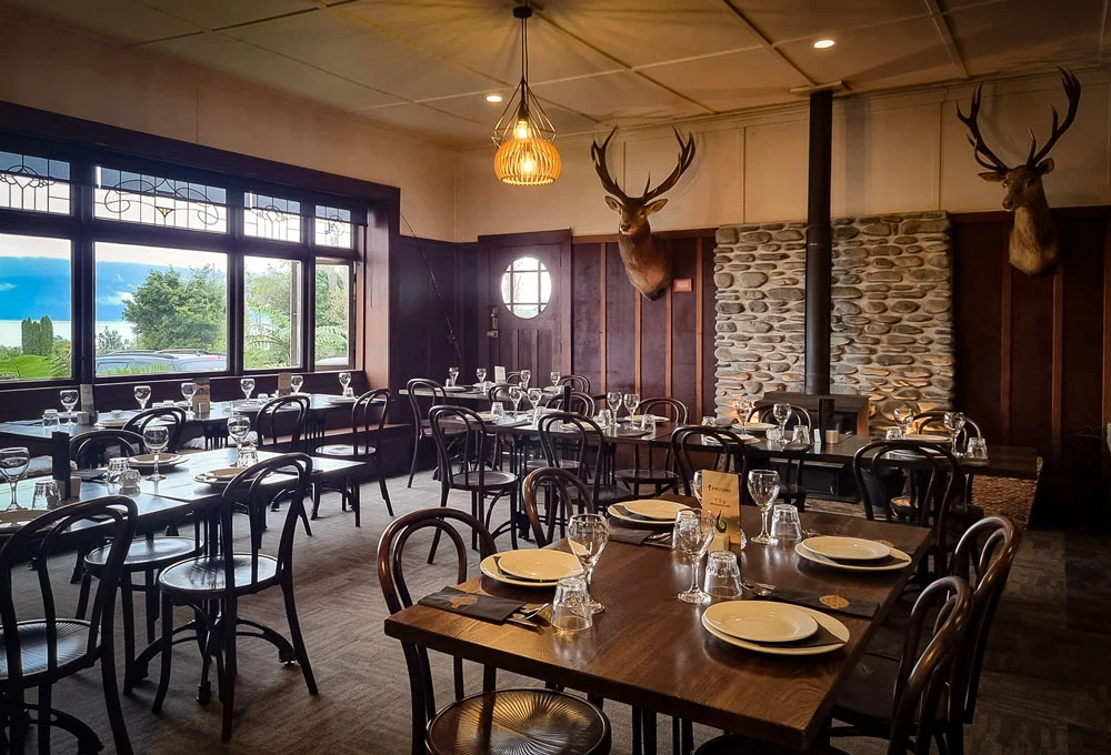 Hotel Lake Brunner Kingfisher Restaurant interior, including stag wall hangings