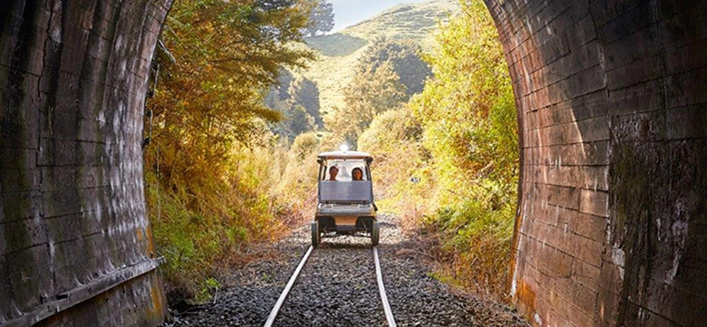 Rail cart adventure coming through a tunnel in Taumarunui