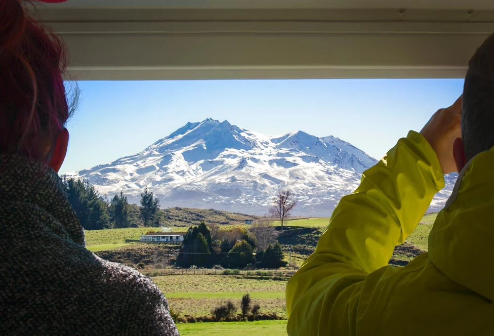 Ruapehu viewed through the open air viewing carriage on the Northern Explorer train